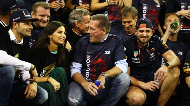 ABU DHABI, UNITED ARAB EMIRATES - DECEMBER 12: Kelly Piquet and Jos Verstappen wait for the celebrations with 2021 F1 World Drivers Champion Max Verstappen of Netherlands and Red Bull Racing after the F1 Grand Prix of Abu Dhabi at Yas Marina Circuit on December 12, 2021 in Abu Dhabi, United Arab Emirates. (Photo by Bryn Lennon/Getty Images)