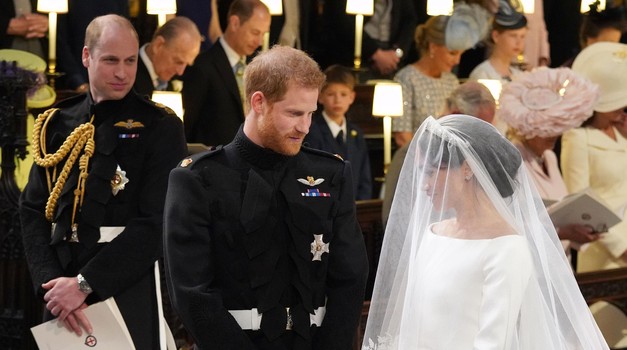 File photo dated 19/05/2018 of Prince William (left) watching Prince Harry and Meghan Markle during their wedding at St George's Chapel, Windsor Castle. The Duke and Duchess of Sussex have begun to use the titles prince and princess for their children Archie and Lilibet. Harry and Meghan's youngsters became a prince and princess when the King acceded to the throne, but have remained a plain "master" and "miss" on the Buckingham Palace website for the past six months. Issue date: Wednesday March 8, 2023. Photo: Jonathan Brady/PRESS ASSOCIATION